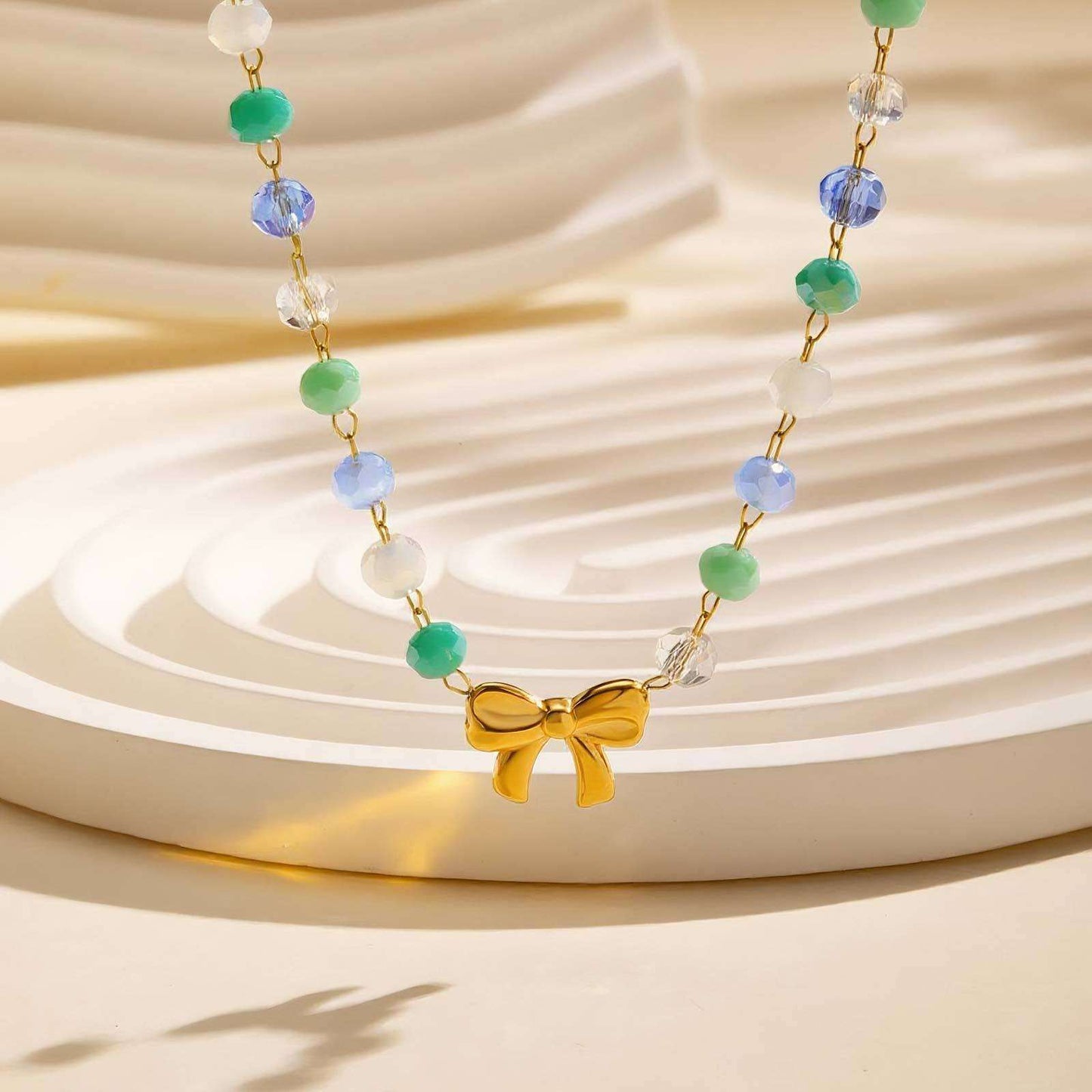 Beaded Necklace with Gold Bow Pendant image 0