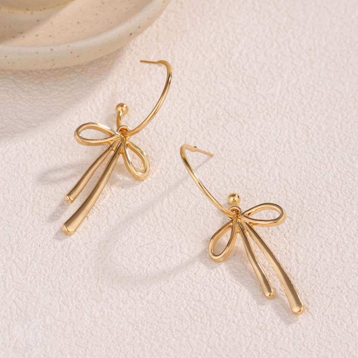 Elegant Gold Bow Tie Dangle Earrings image 1