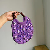Handbag with Metallic Embellishments