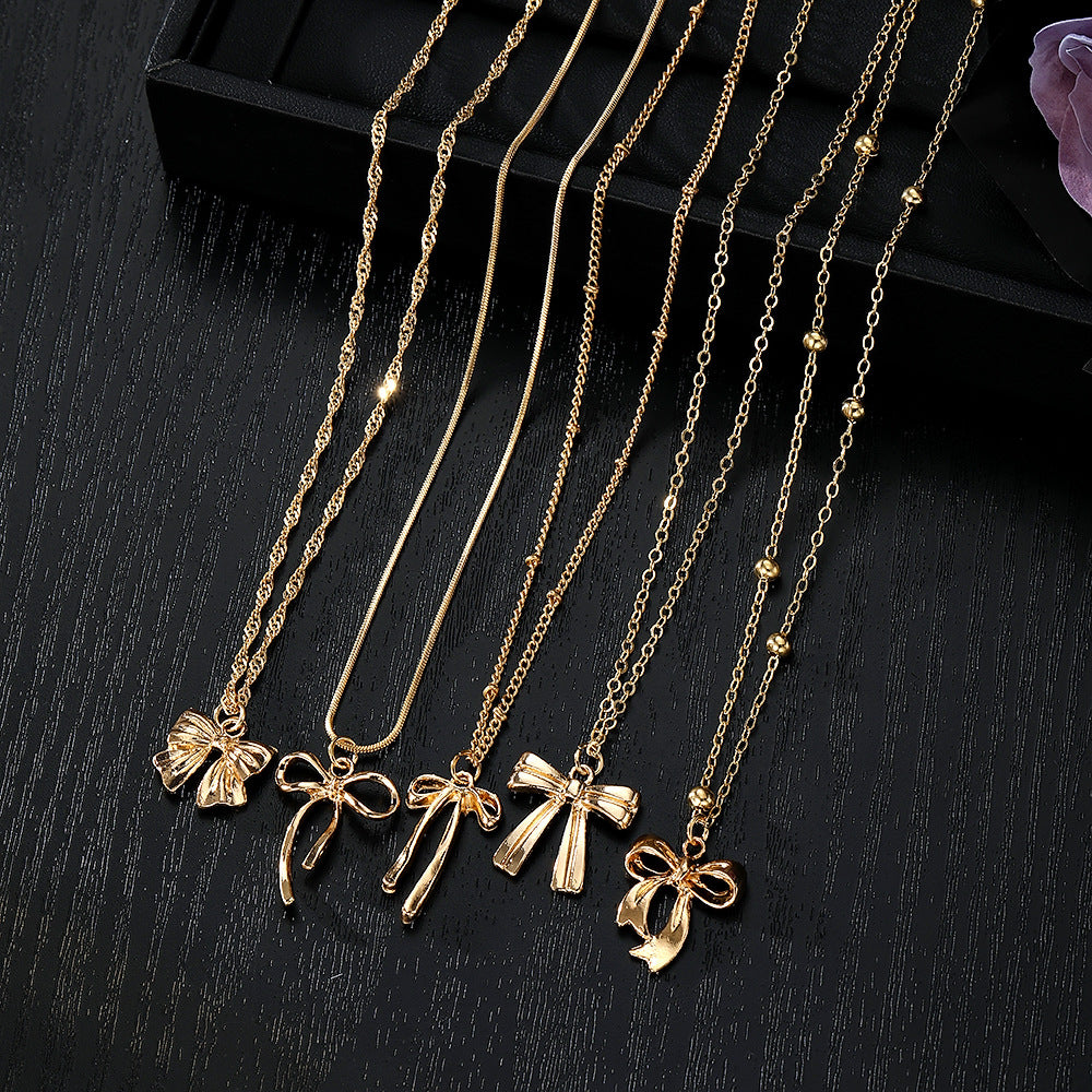 Layered Necklace Set with Bow & Floral Charms