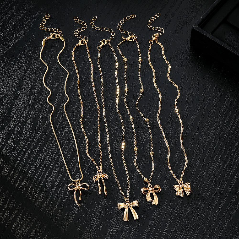 Layered Necklace Set with Bow & Floral Charms