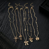 Layered Necklace Set with Bow & Floral Charms
