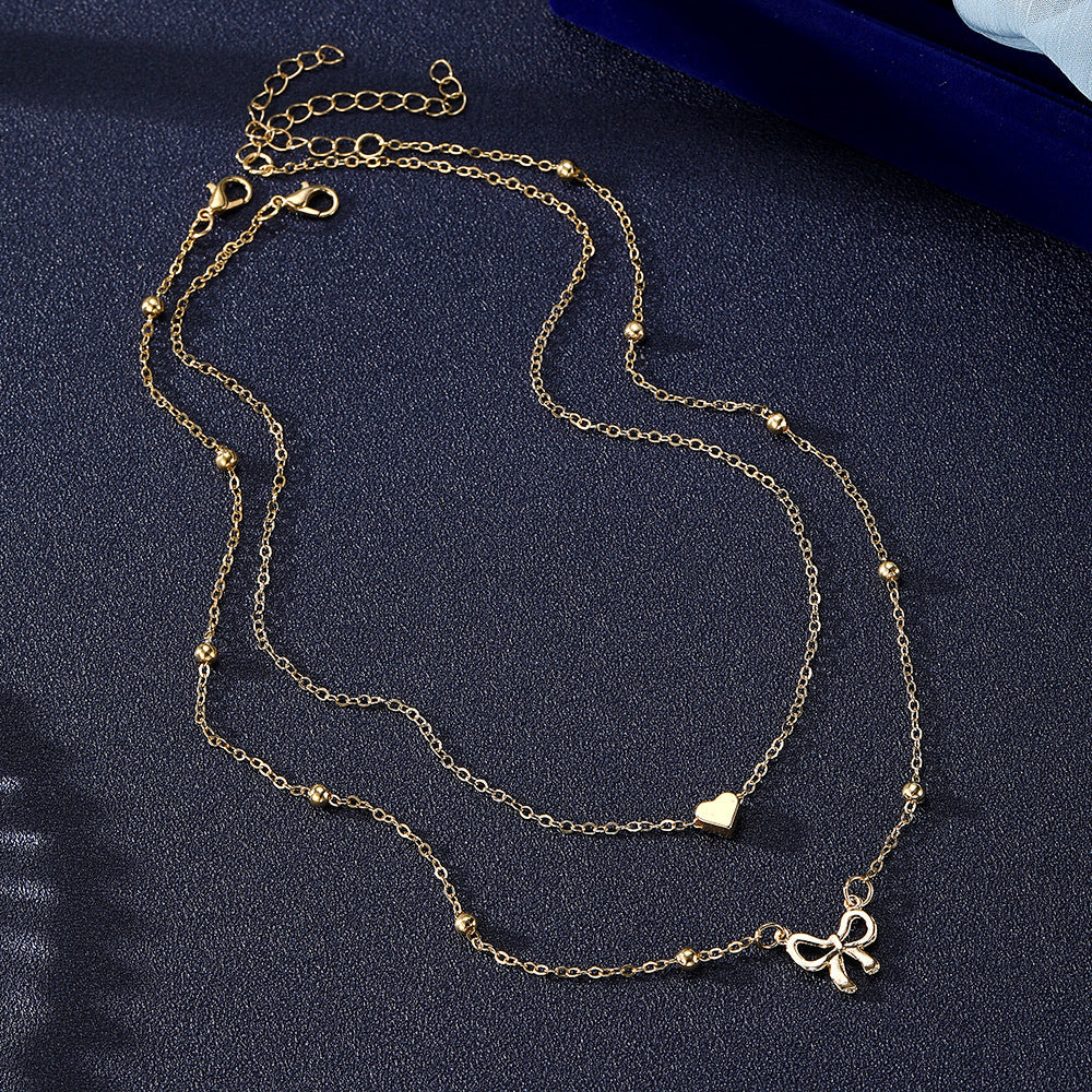 Layered Gold Heart & Bow Pendant Necklace