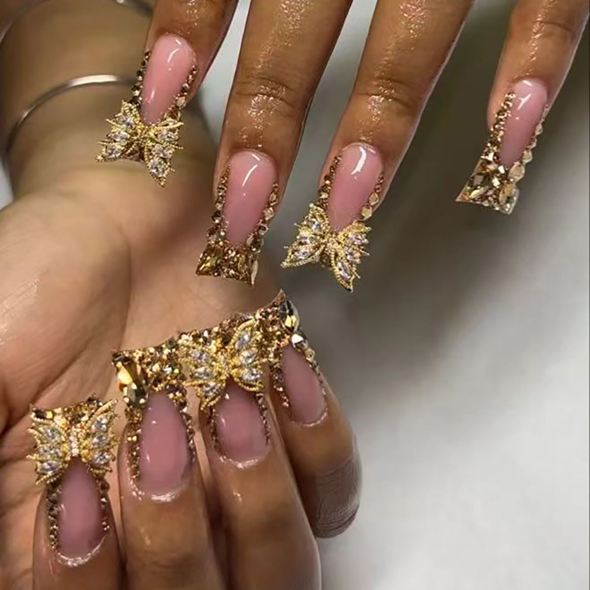 Butterfly and Leaf Embellished Nail Art