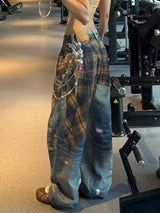 Distressed Wide-Leg Jeans with Plaid Layering