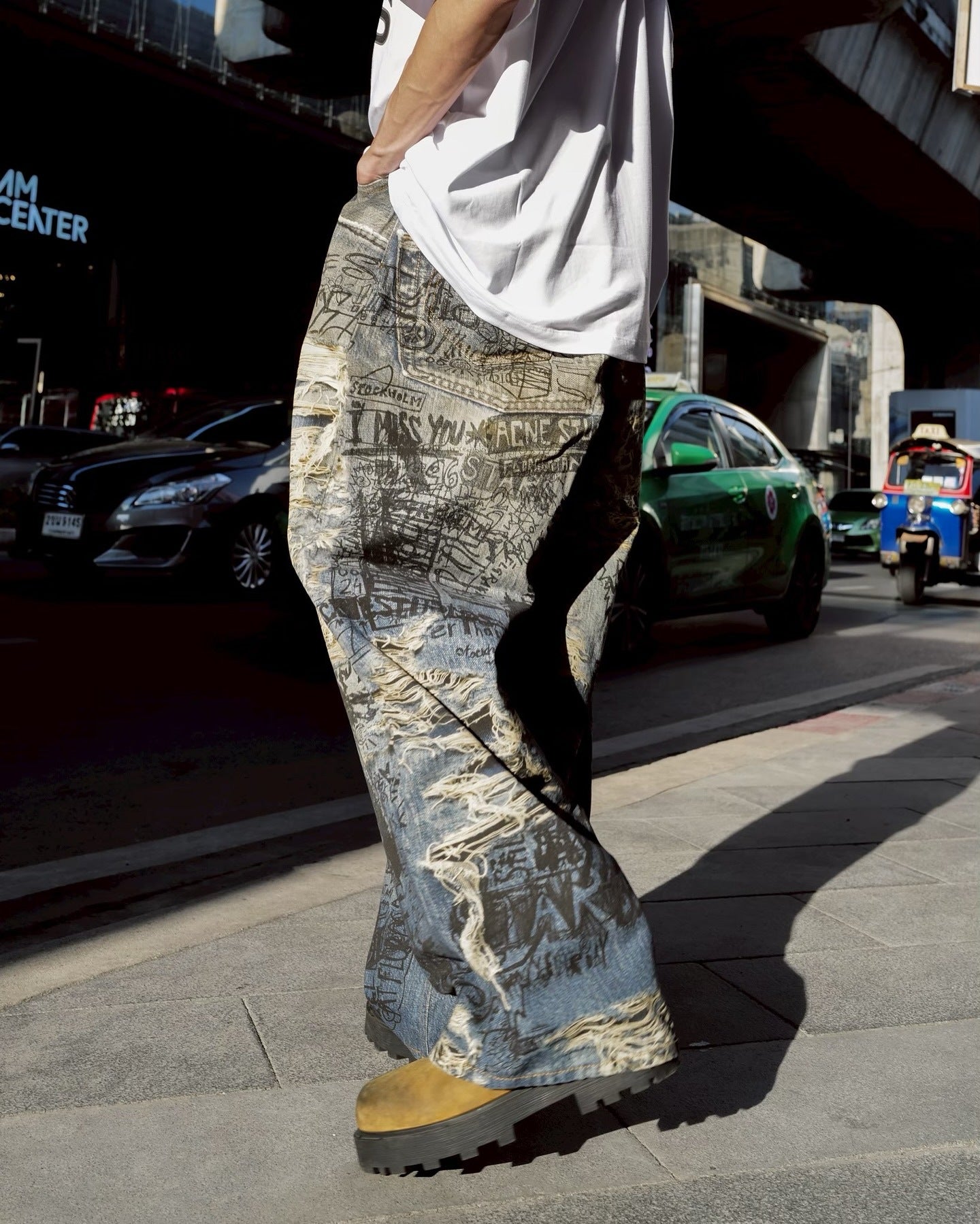 Avant-Garde Graffiti Print Ripped Jeans