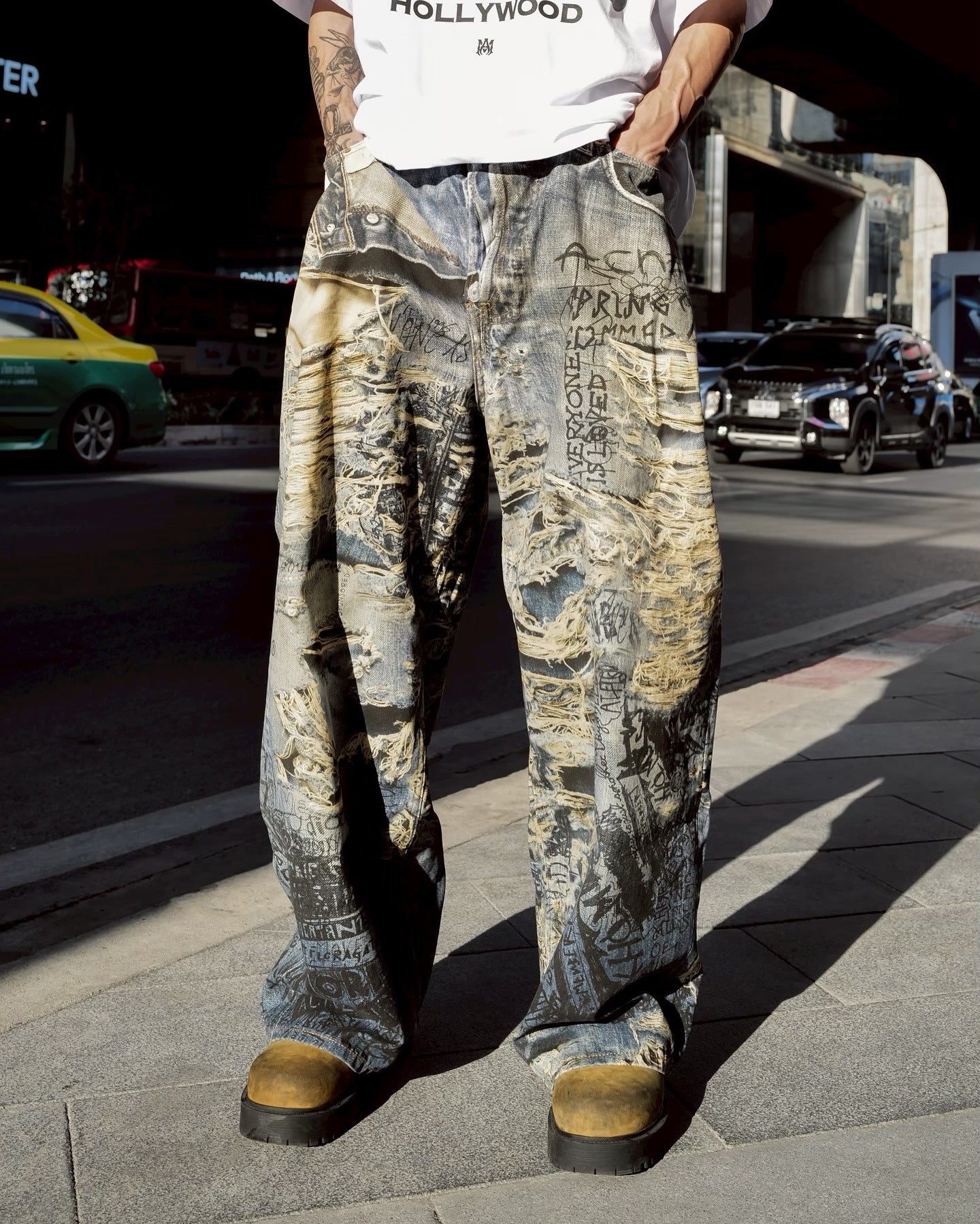 Avant-Garde Graffiti Print Ripped Jeans
