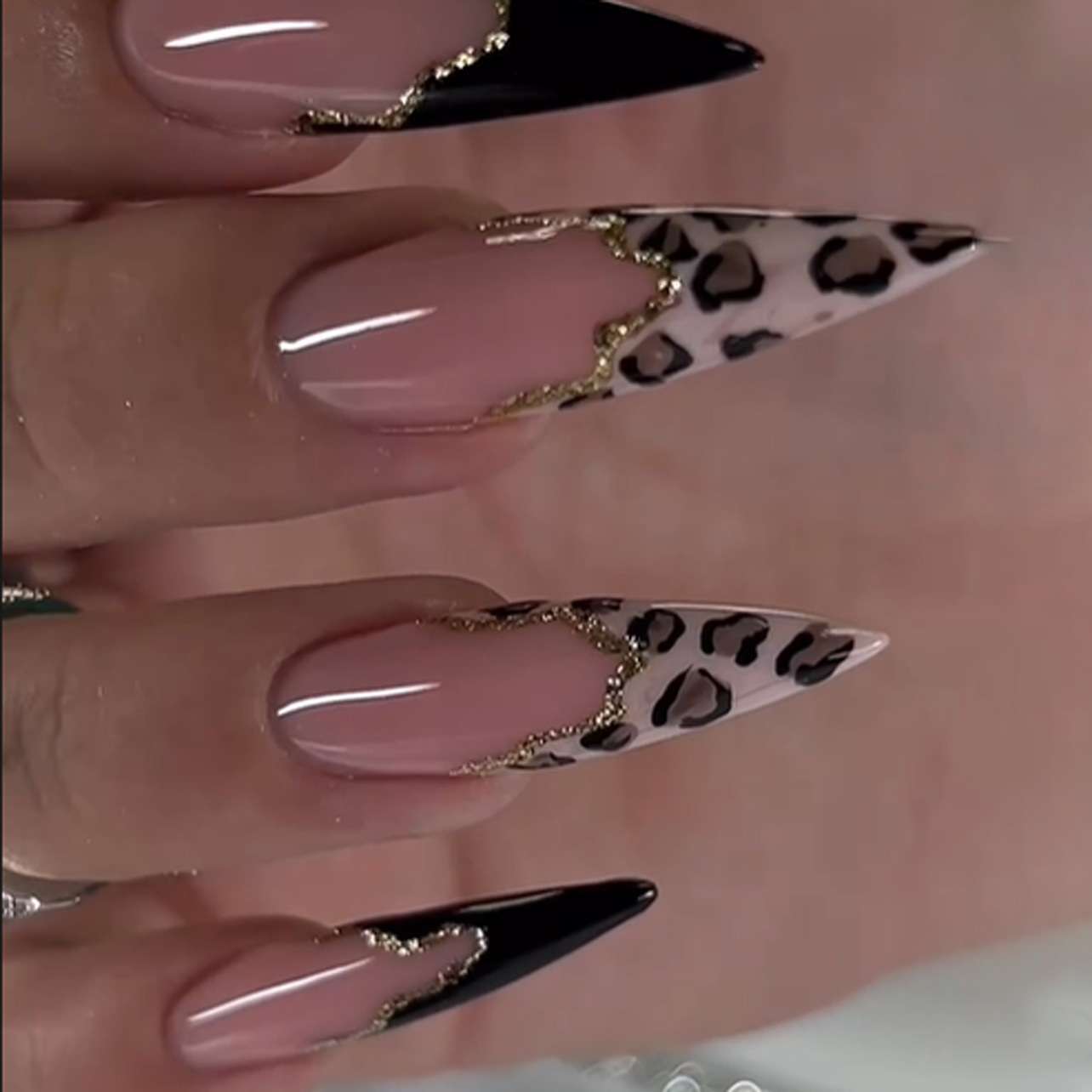 Nail Art with Leopard and Black Tips image 0